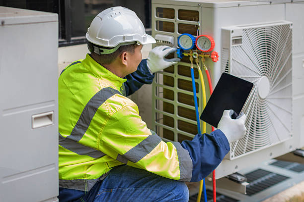 Professional Heat Pump Repair technician working in Harvest, AL